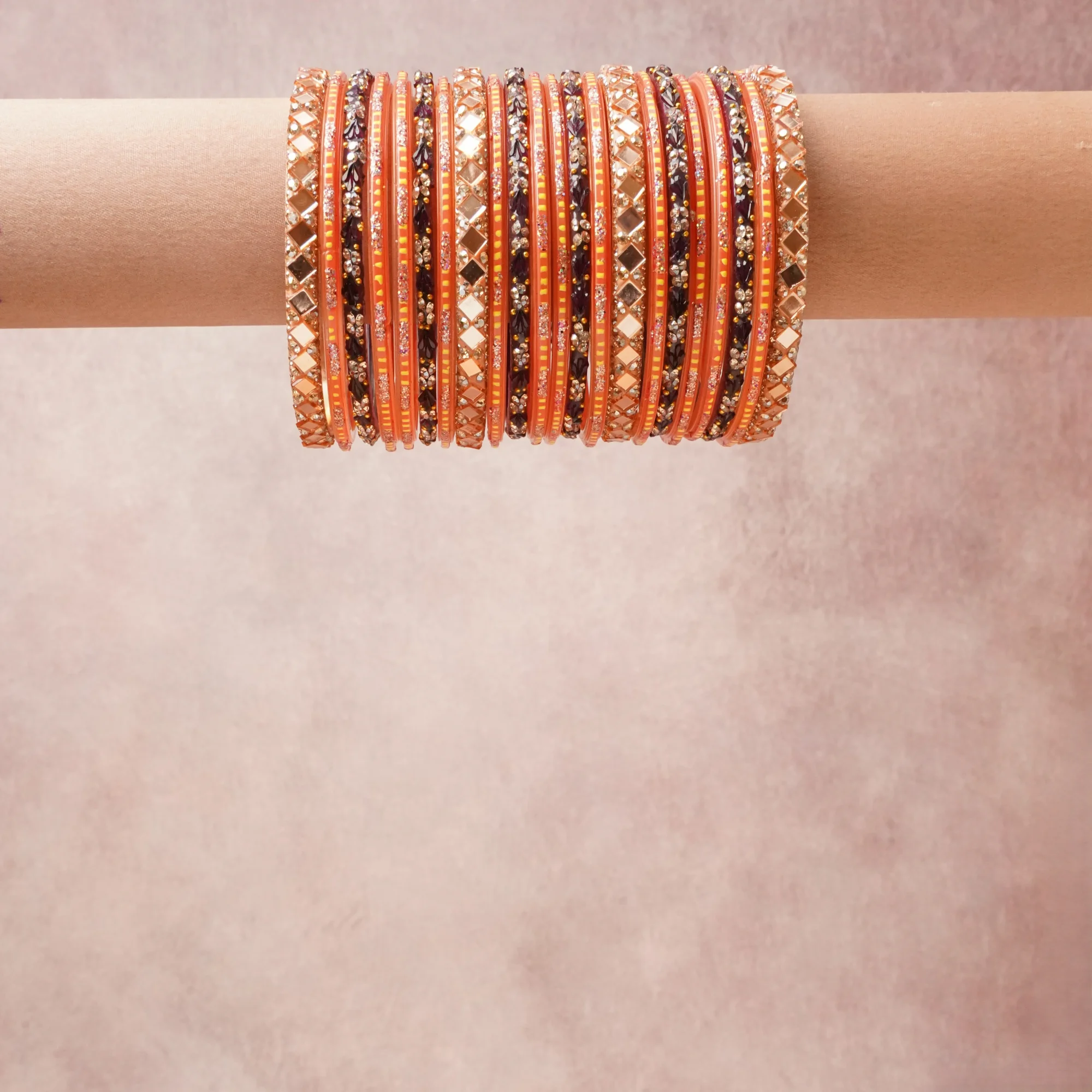 A grounding Rose Gold forms the heart of the set, while touches of Silver add charm.

A thoughtful composition of Metal Alloy, Lacquer, Glass Mirrors, Glass Crystals, designed to feel complete without being heavy.
Each element layers seamlessly, creating a look that is refined, wearable and quietly striking.